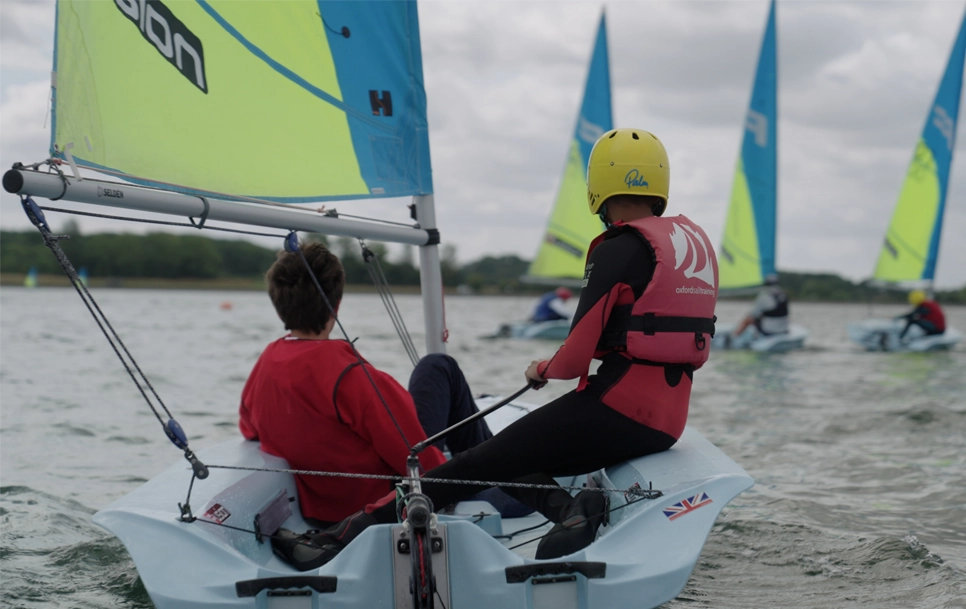 Two Youths in a sailing boat.