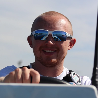 Harry driving a boat