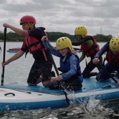 Youths paddling